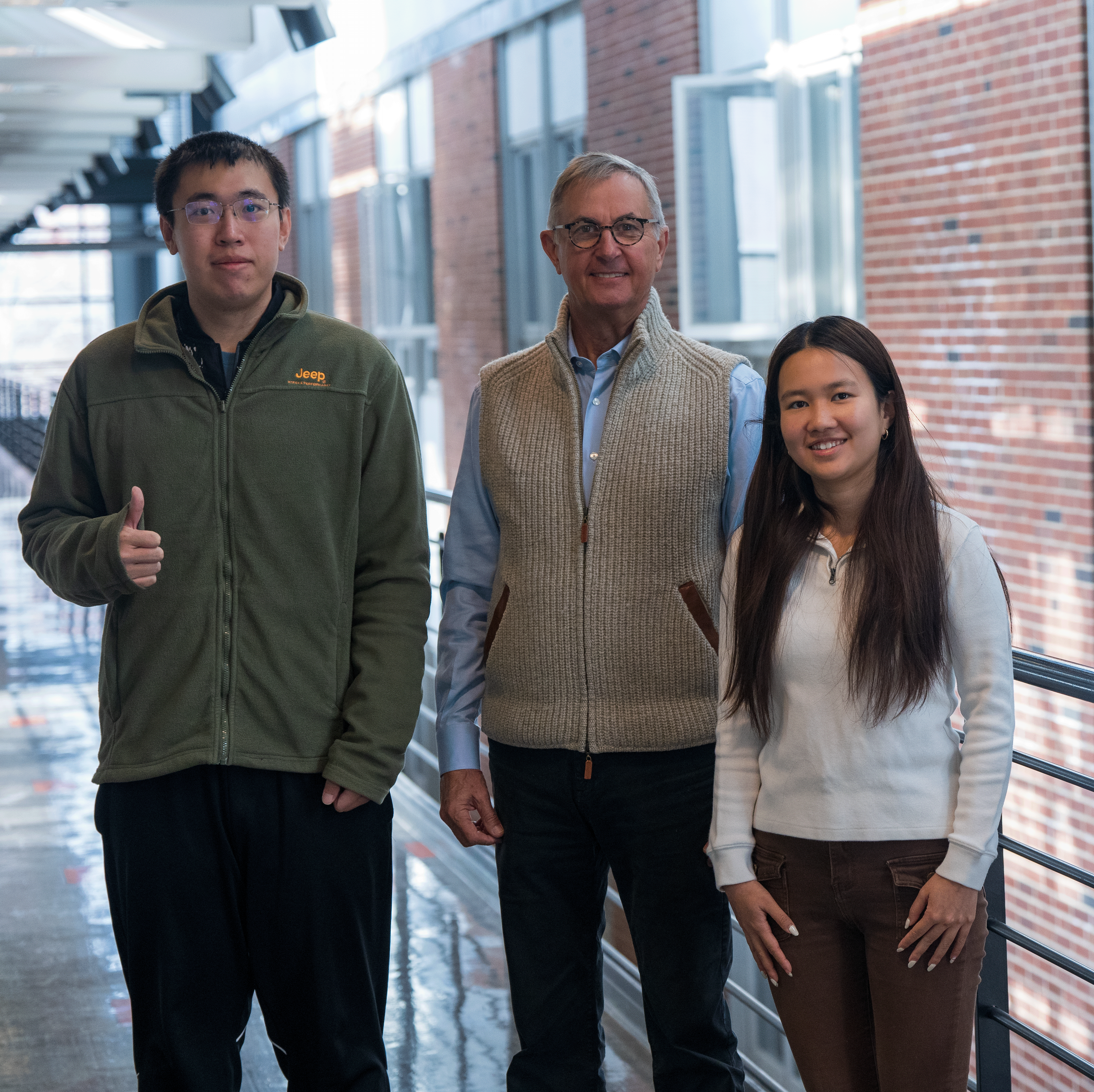 Two graduate students posing with Brad Mottier, ISE alumnus and founder of the Mottier Innocavation Challenge