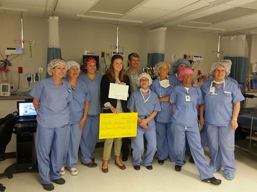 Mary Beth at Des Peres Hospital in St. Louis receiving a check for $1350 for her clean water system project&mdash;the result of a vigorous fundraising effort by hospital staff.