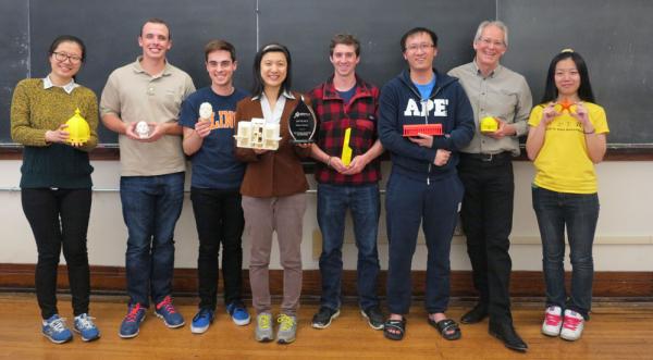 Senior Lecturer Leake and his lab group, with their Engineering Open House award. From left to right: Ziying Xiang, Mike Halloran, Andre Allemann, Julianna Ge, David Graveline, Yijun Dai, Jim Leake, Shilin Xia.