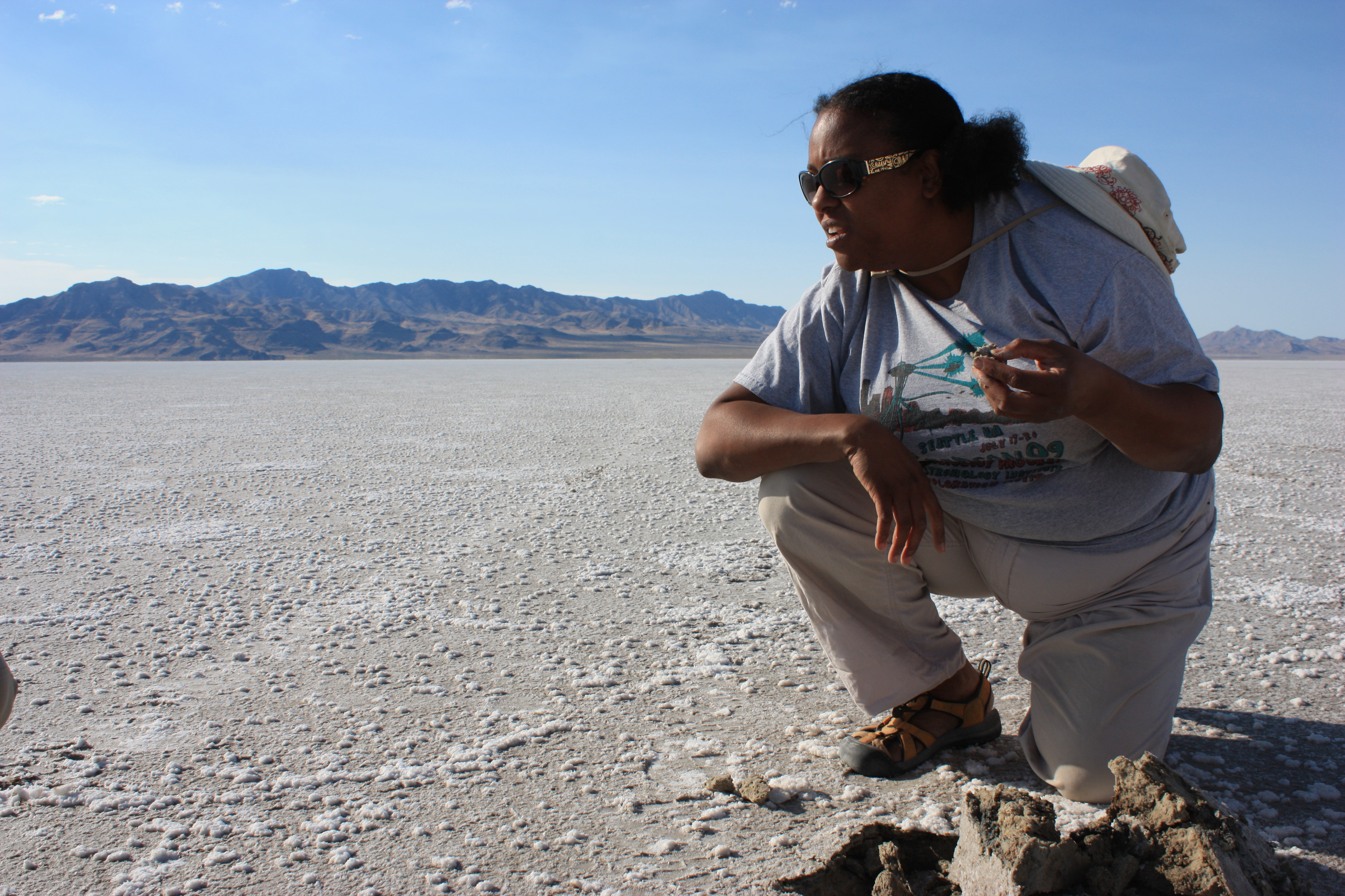 Lynch examining microbial mats in the Pilot Valley Basin, a paleolake basin in Utah. Photo by NASA Astrobiology Institute.