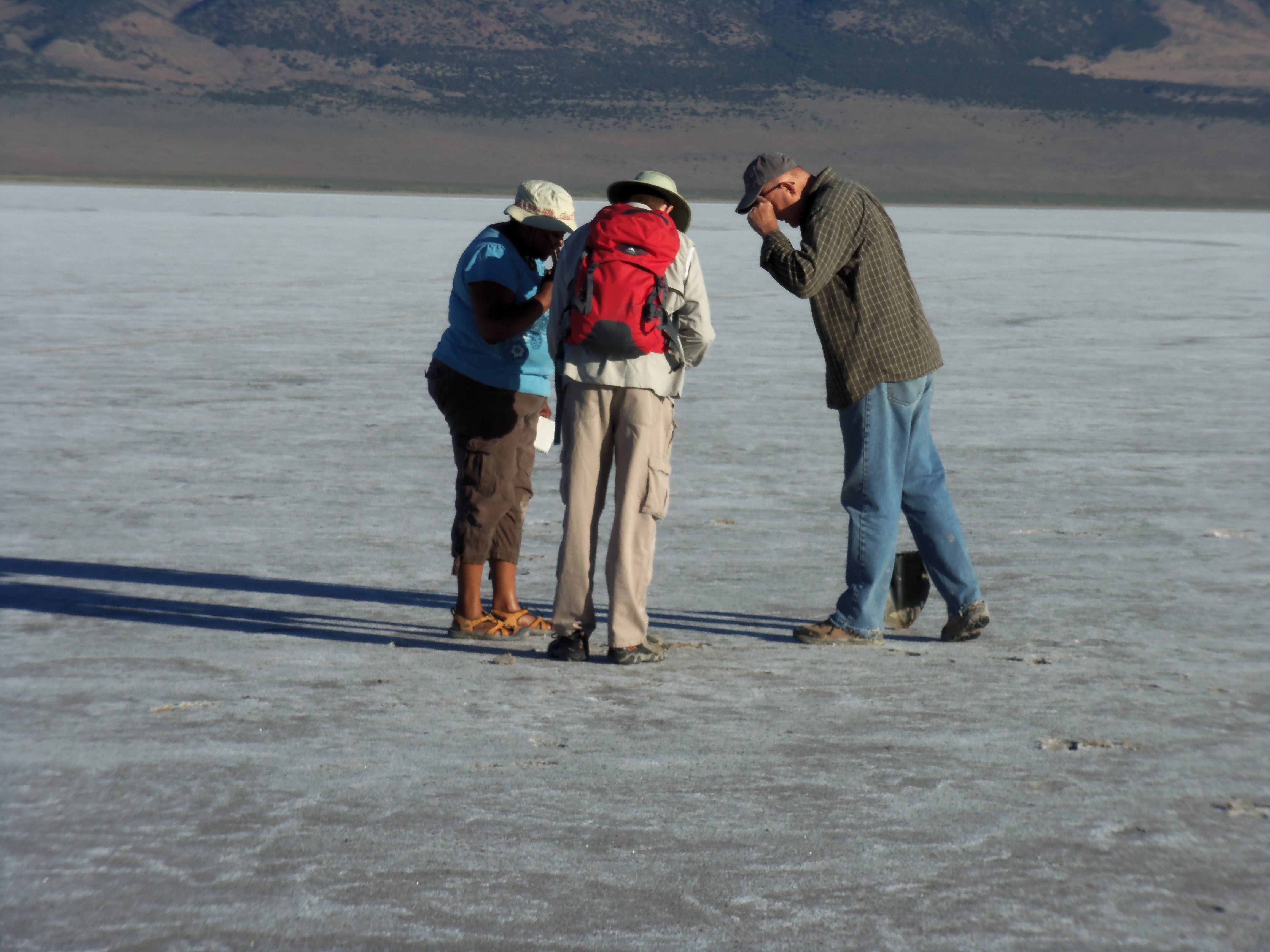 Lynch and her colleagues investigating unique and randomly dispersed features in the Pilot Valley Basin. Photo by Robin Schneider. 