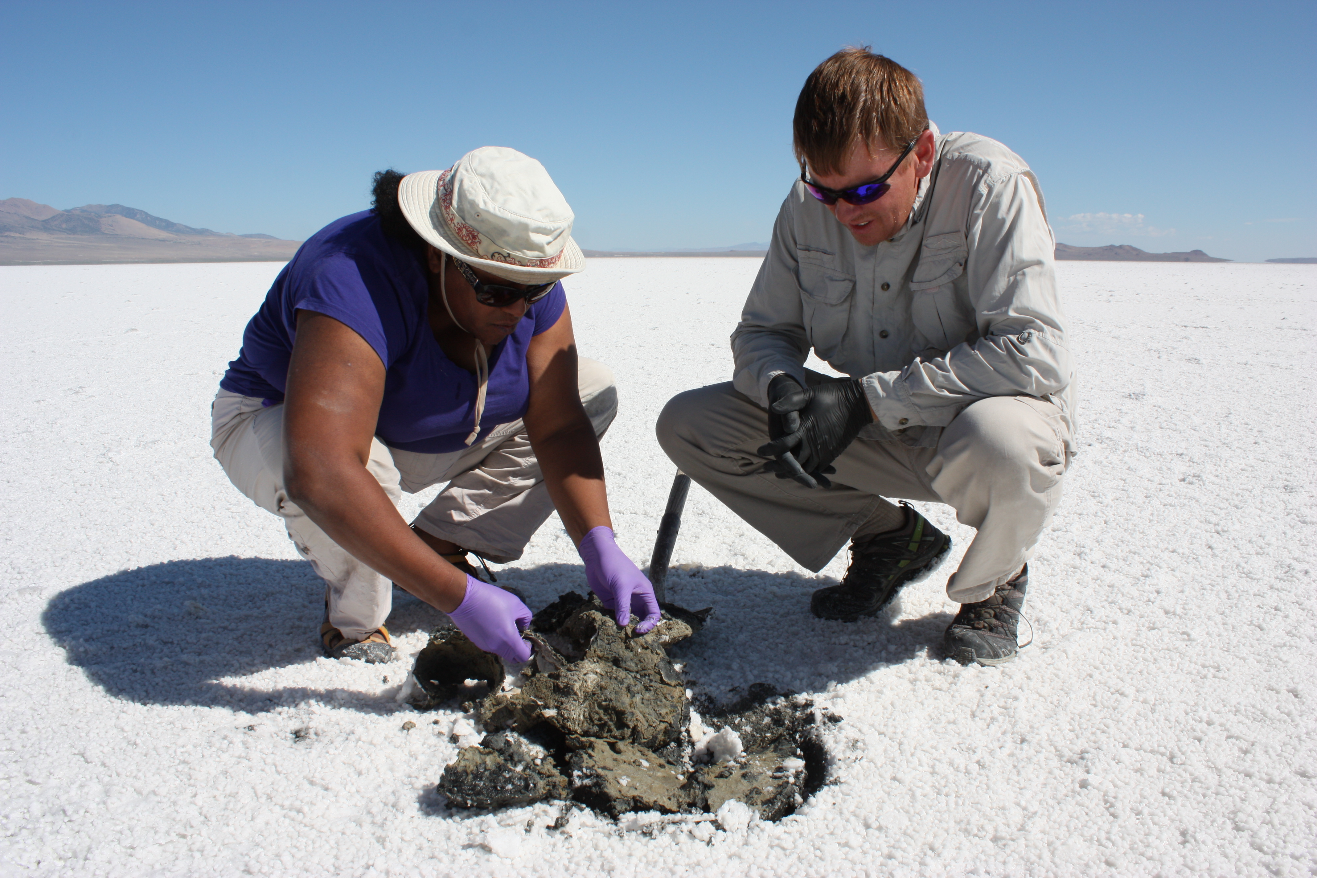 Lynch and her collaborator, Kevin Rey from Brigham Young University, examining sediments and overlying microbial mats. Photo by NASA Astrobiology Institute. 