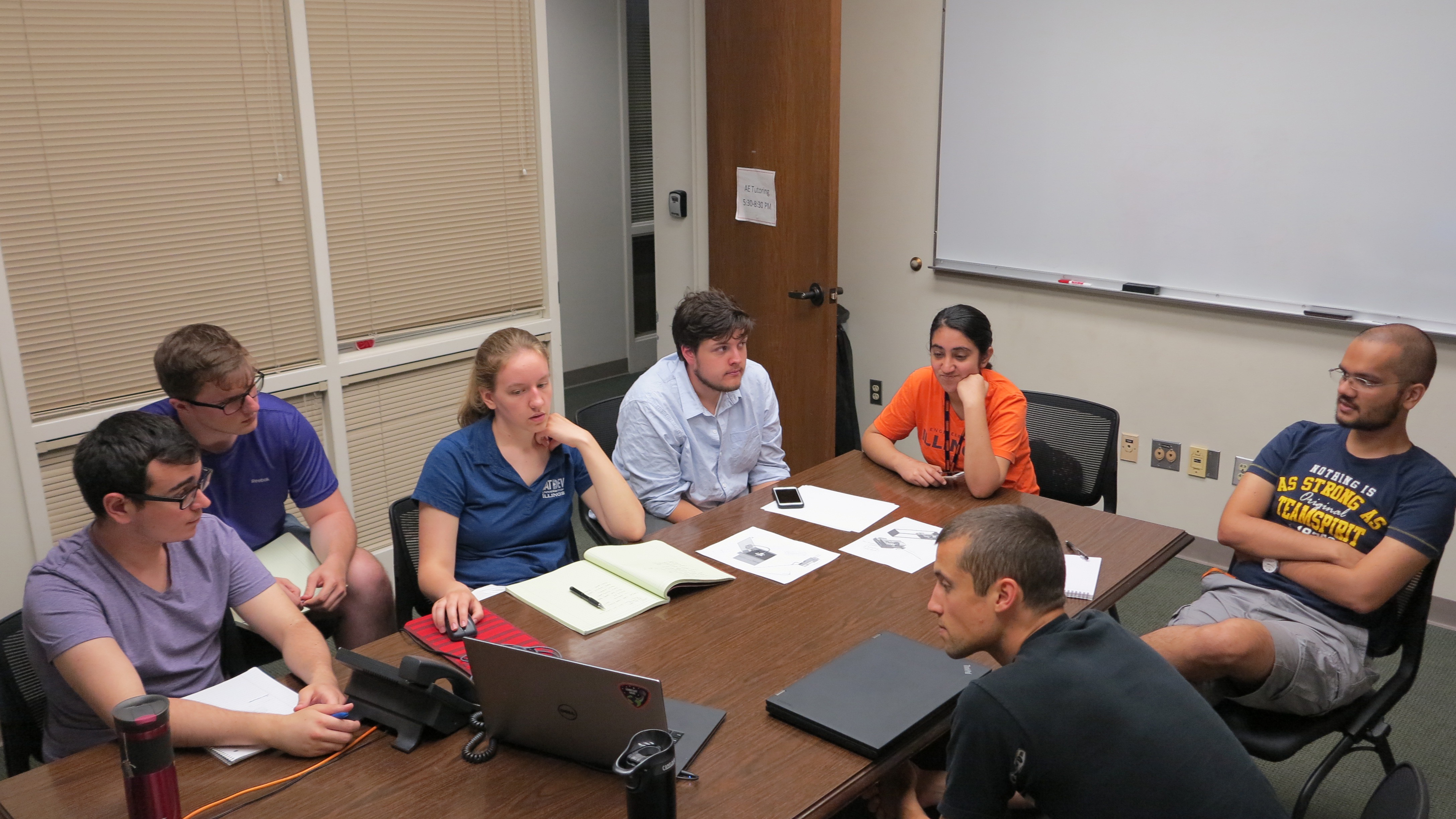 Leading members of CAPSat meet to discuss their progress. From left to right, Oguzhan Altun, Joe Stahl, Dawn Haken, Tiago Silva, Yukti Kathuria, Patrick Haddox, Vedant and, present by phone, McKale Berg.