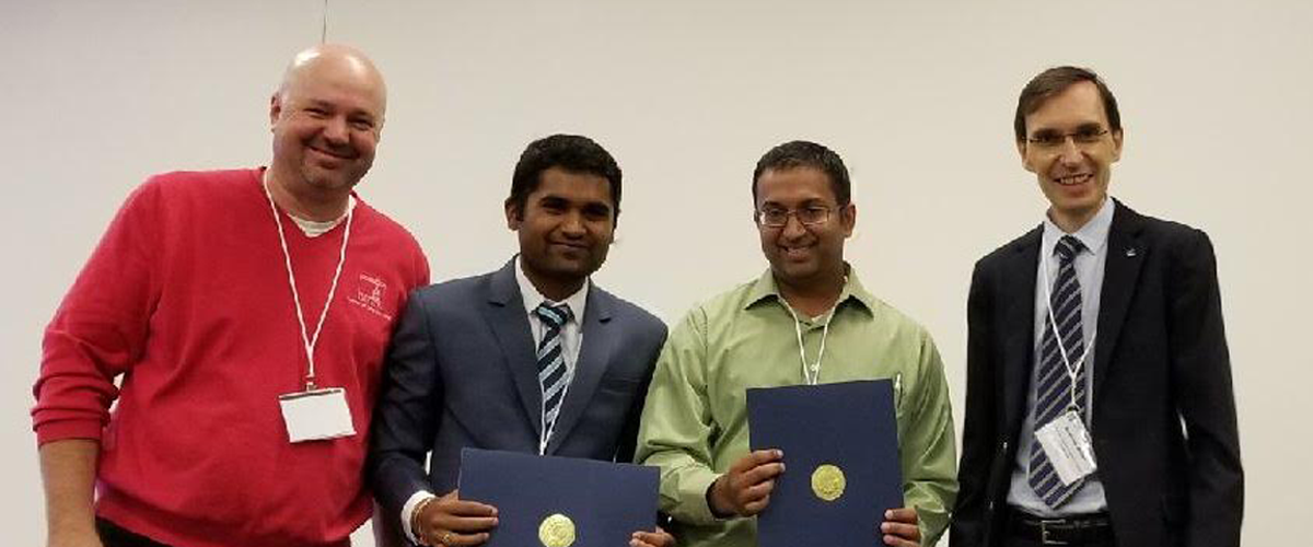 Krishnan and Patiballa as they receive their award. From left to right: Andrew P. Murray, conference session organizer, Sreekalyan Patiballa, Girish Krishnan, and Andreas Mueller, chair of 41th Mechanisms and Robotics Conference.