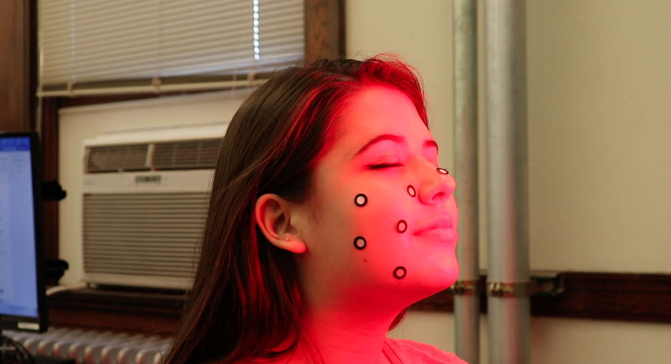 A student in SE101 has her face scanned.