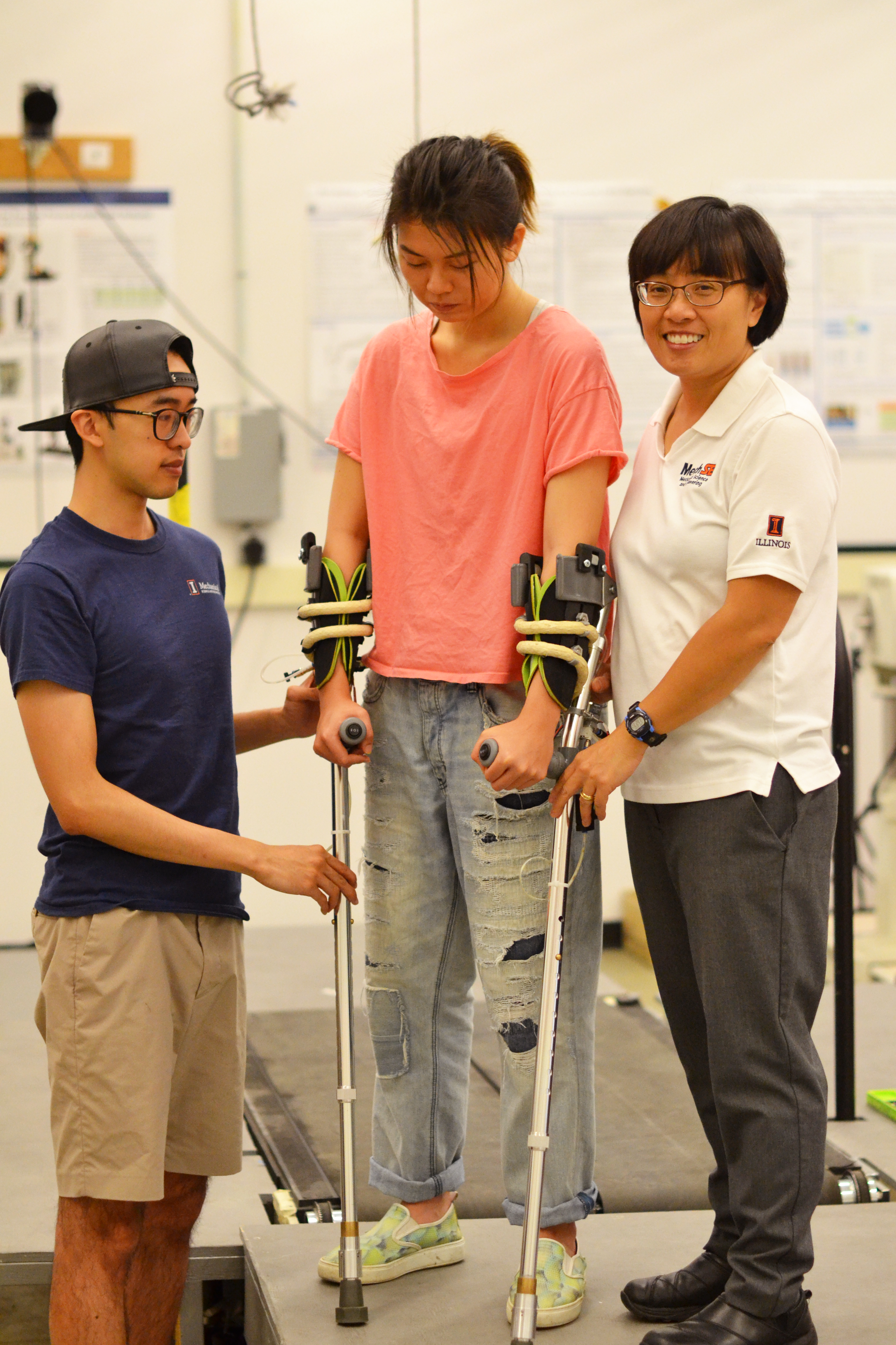 Graduate student Chenzhang Xiao, left, and Professor Elizabeth Hsiao-Wecksler, right, demonstrate their energy-harvesting mechanism within the crutch.