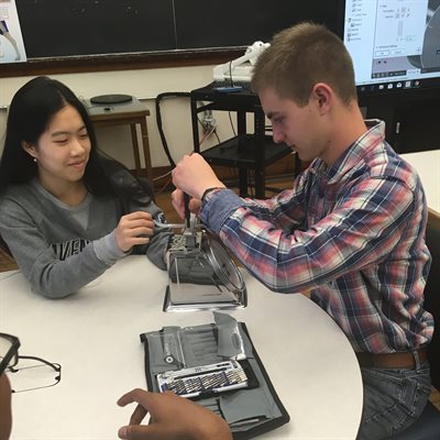 Priscilla Yuan (IE) and Sam Weiss (SE) dissecting a kitchen scale. 